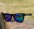 Svarte polariserte solbriller (blågrønt glass)
